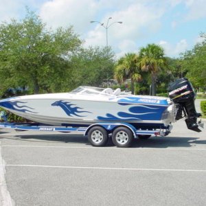 Blue flamed 24 Checkmate 300xs on trailer.jpg