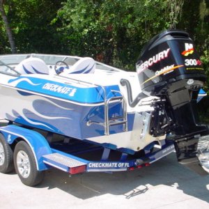 Blue flamed 24 checkmate 300xs motor rear.jpg
