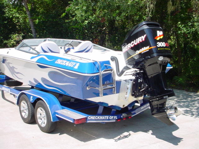 Blue flamed 24 checkmate 300xs motor rear.jpg